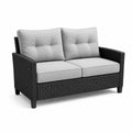 Dwuosobowa sofa ogrodowa z technorattanu z szarymi poduszkami